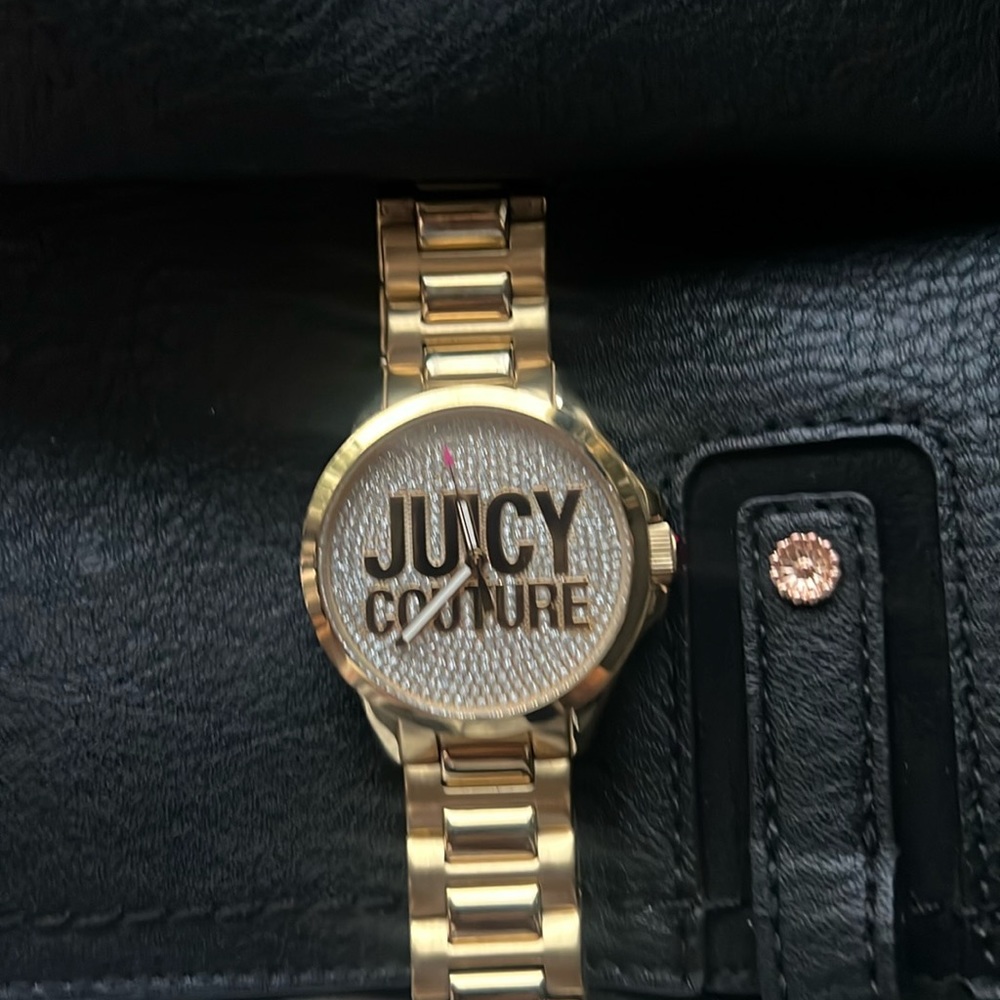 like new Juicy Couture watch, no scratches. Just needs new battery.
